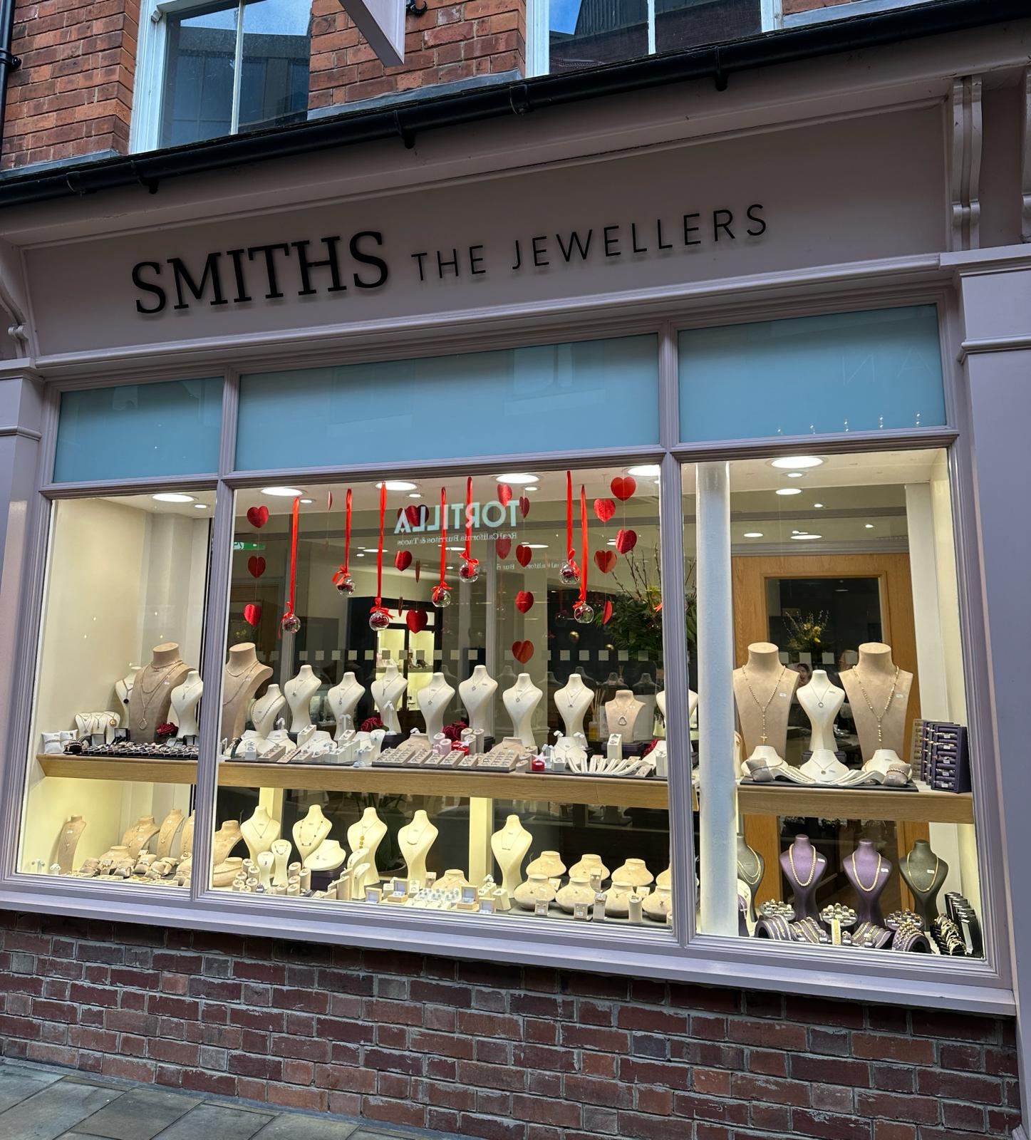 Lady looking at a jewellery display